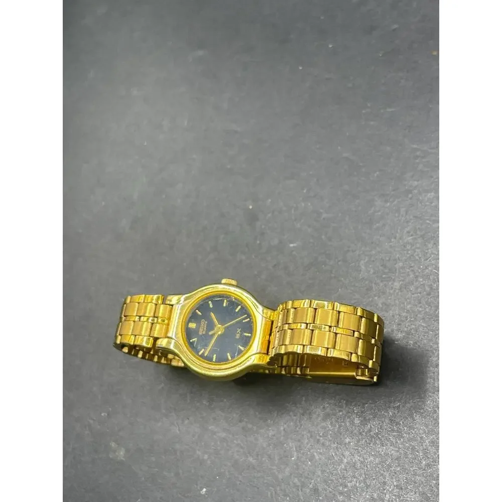 Seiko SX V401-0091 Womens Quartz Wristwatch Gold Tone Black Dial Vintage